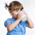 Kid Girl Drinking Milk Or Yogurt From Glass Stock Photo ...